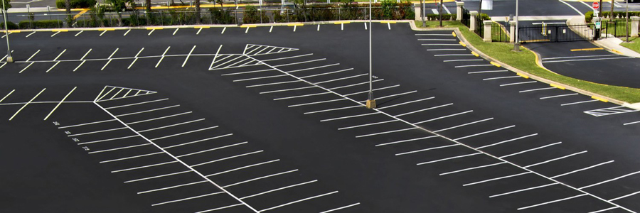picture of parking lot after a fresh sealcoating and striping